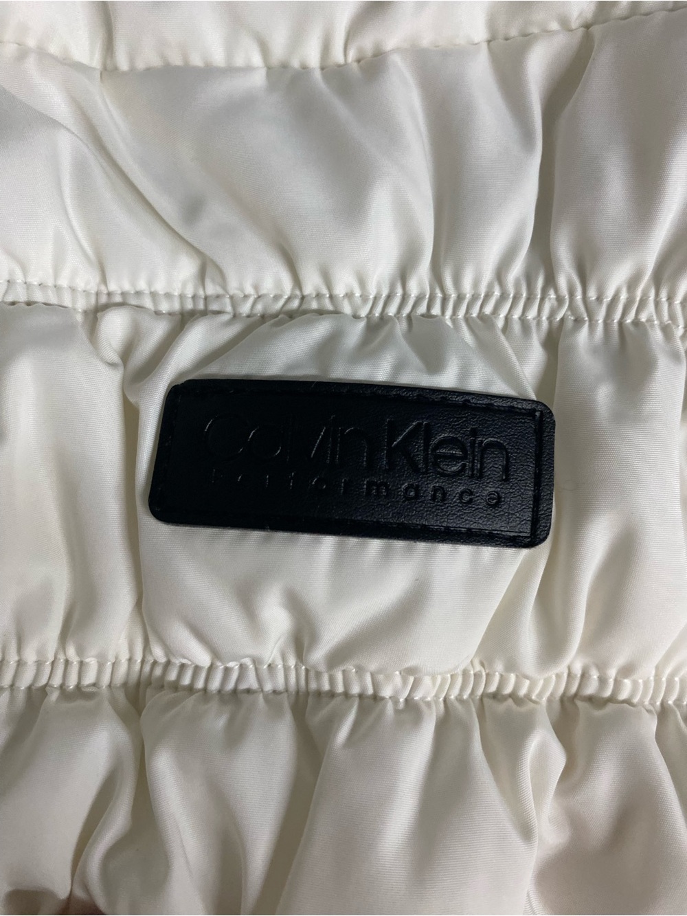 Calvin Klein Women’s White Puffer Jacket with Black Logo Patch